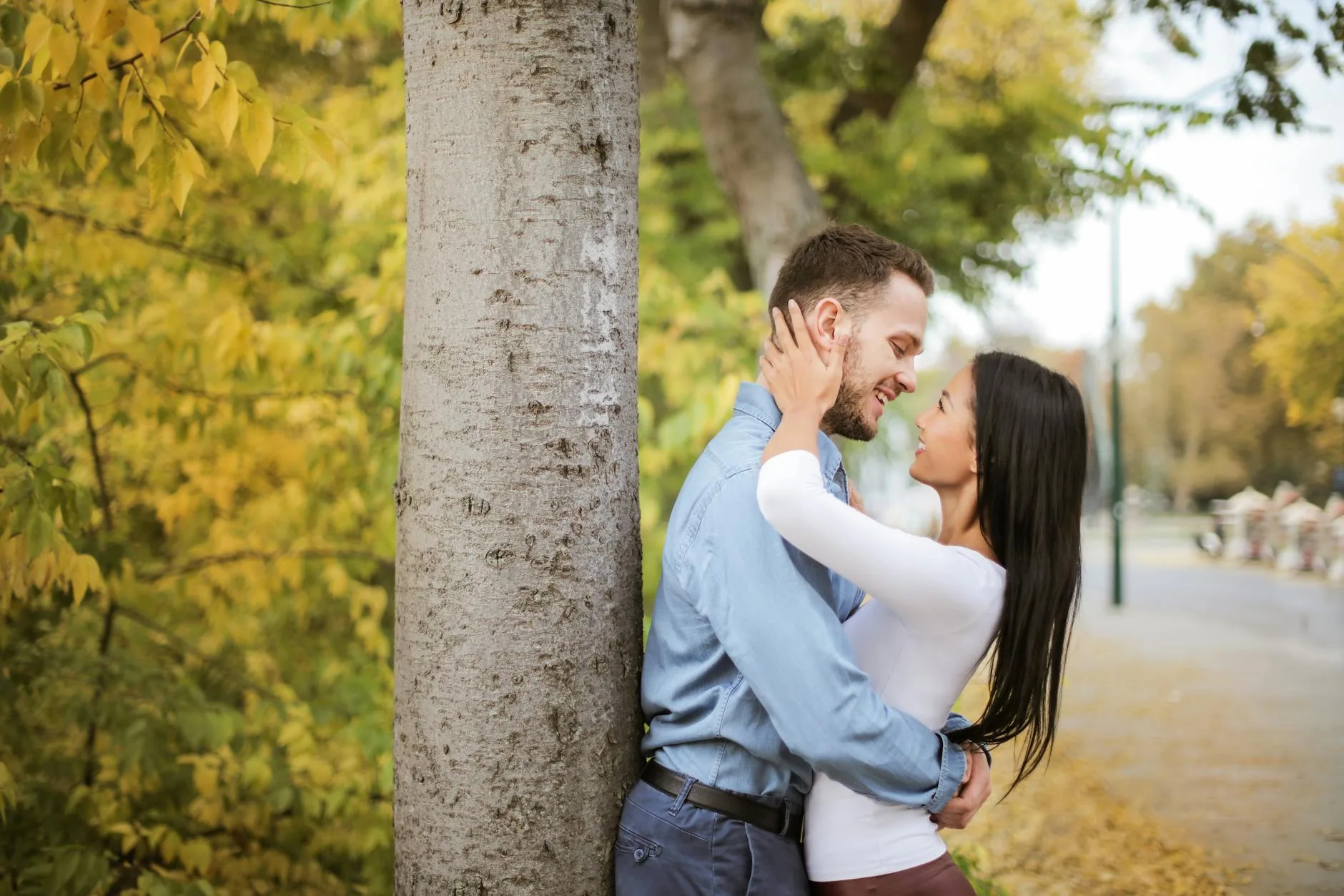 Happy couple embracing outdoors — the kind of genuine connection professional dating services are designed to create